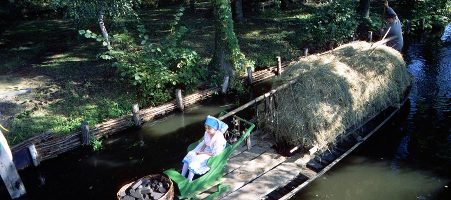 Woman in Sorbian costume in a barge